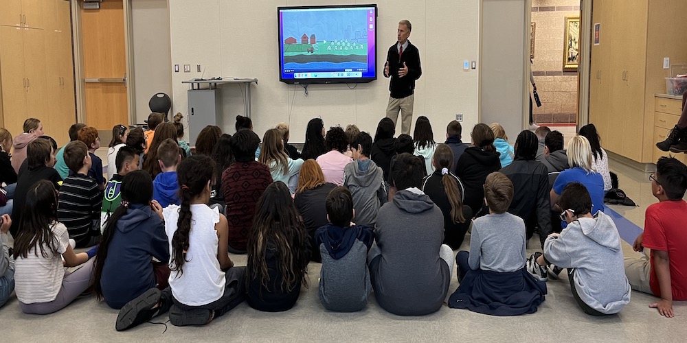 representative from Provo Water speaking to a room full of 5th graders